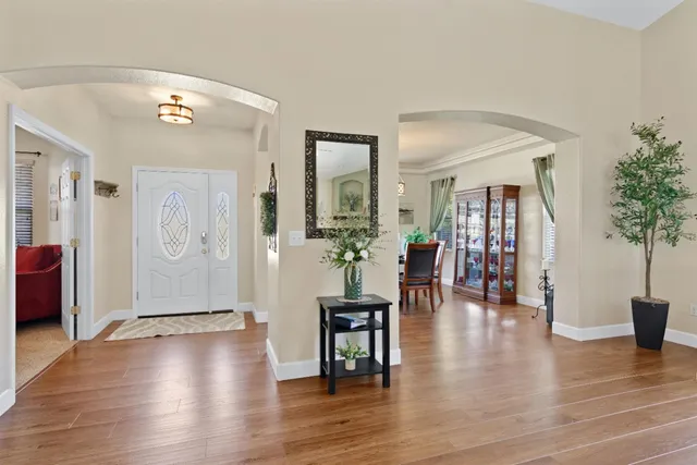 a view of a livingroom with furniture and hardwood floor