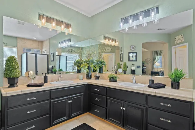 a view of a patio with a table and chairs under an umbrella