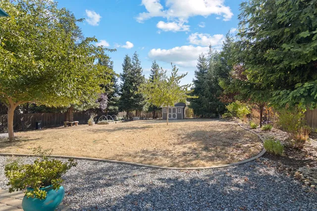 a view of a house with sitting area and garden