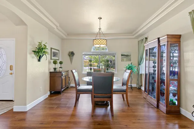a view of a dining room with furniture window and wooden floor