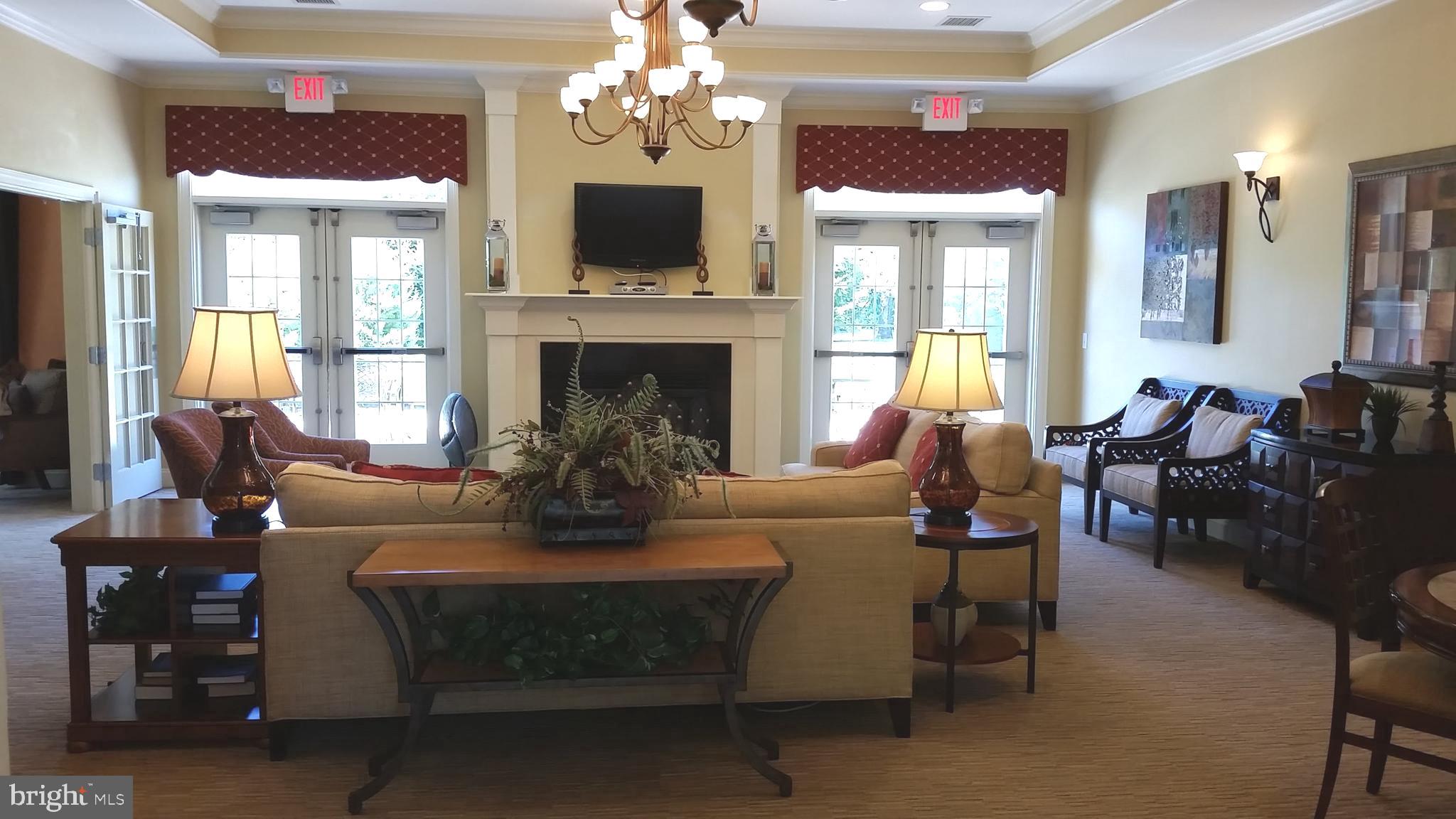 615 Timberlake Drive Ewing, NJ 08618 - Photo 16 of 22 a living room with furniture a fireplace and a chandelier