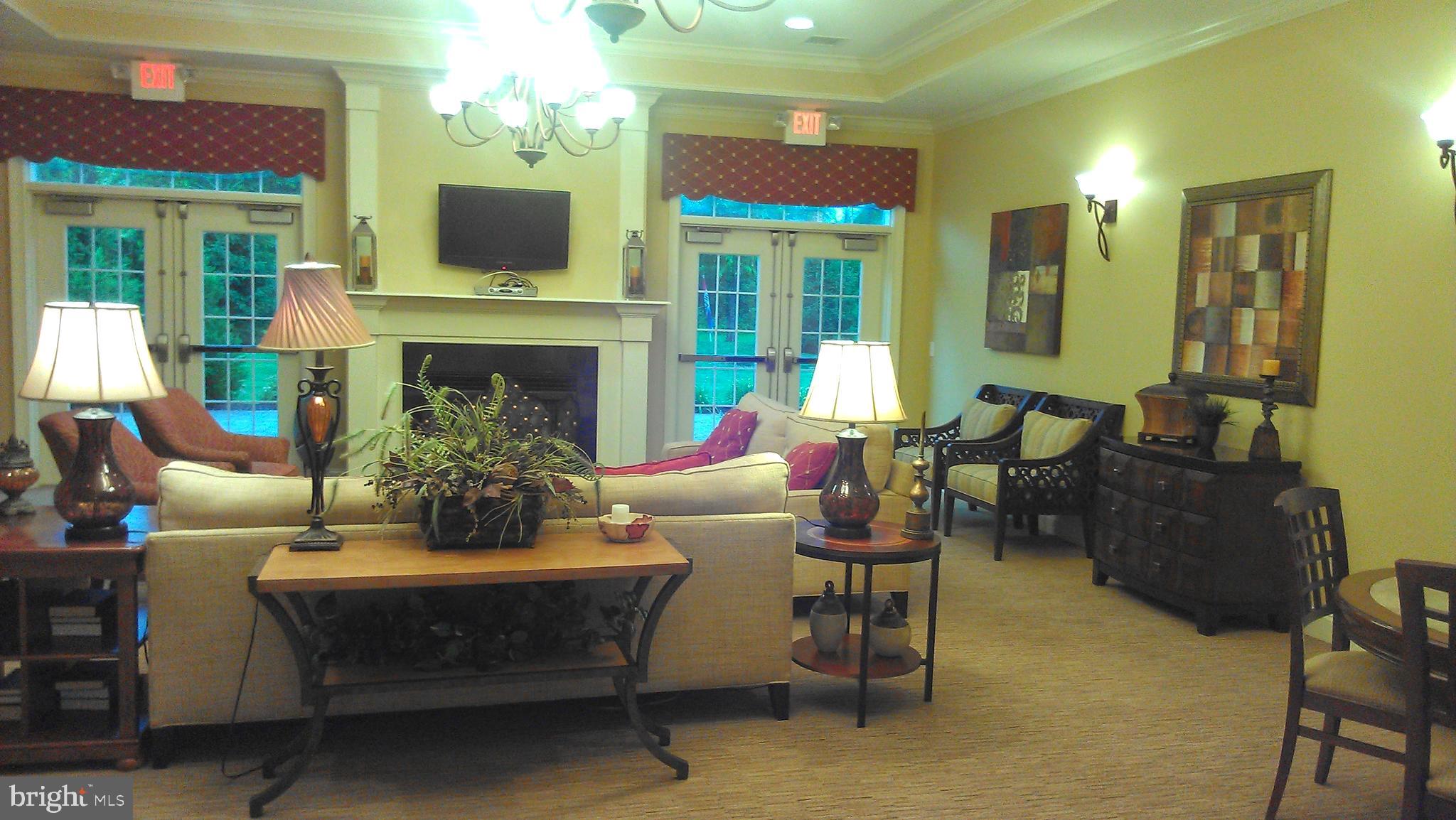 615 Timberlake Drive Ewing, NJ 08618 - Photo 20 of 22 a living room with furniture a fireplace and a chandelier