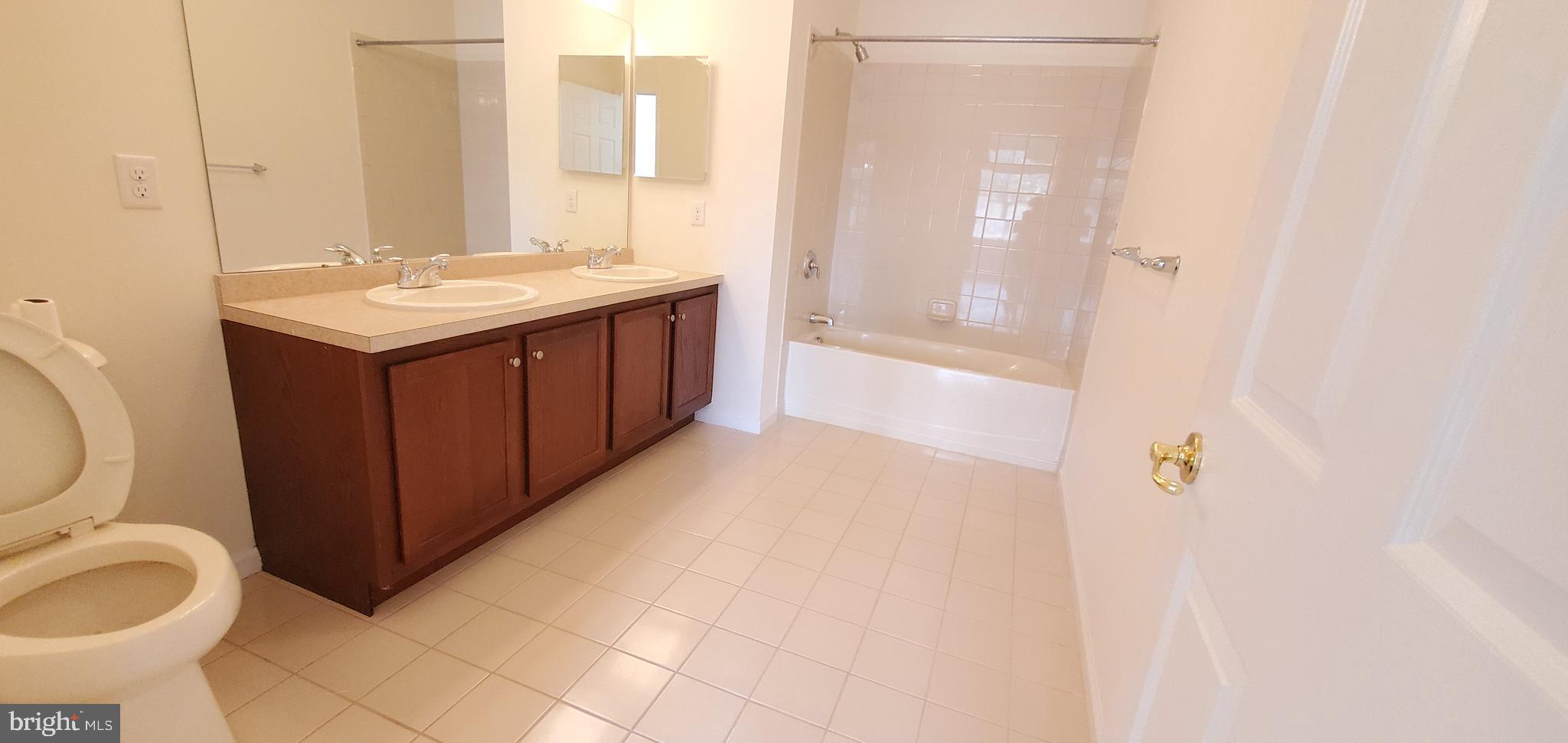 615 Timberlake Drive Ewing, NJ 08618 - Photo 9 of 22 a bathroom with a sink and a mirror
