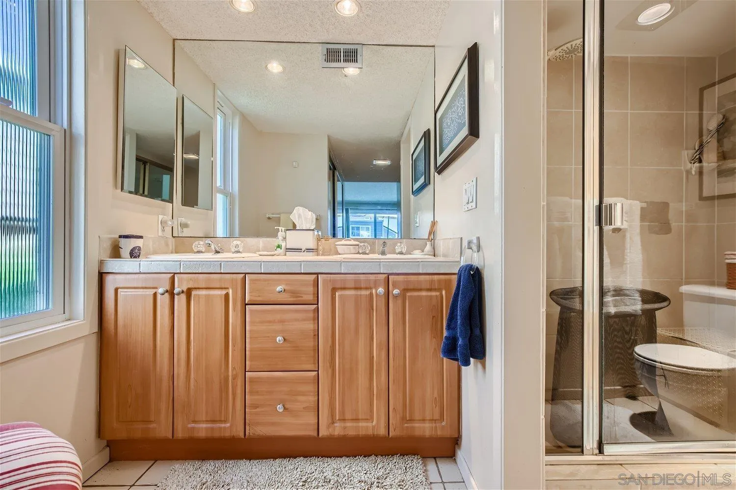 1812 Wilton Road Encinitas, CA 92024 - Photo 11 of 26 a bathroom with a granite countertop sink and a mirror