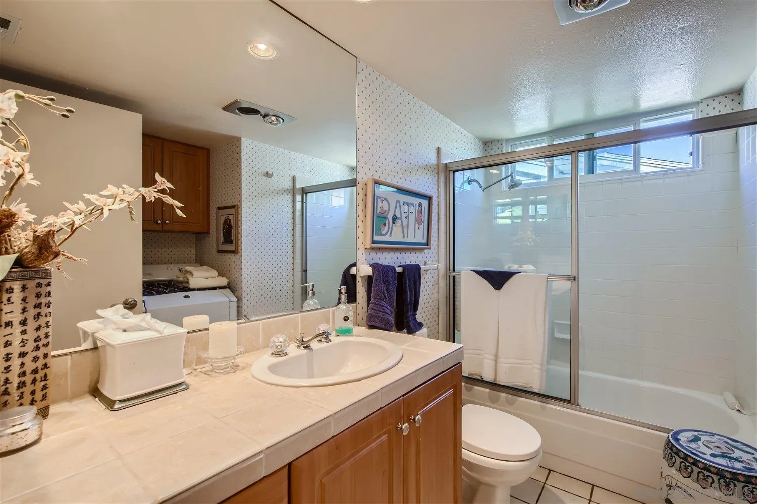 1812 Wilton Road Encinitas, CA 92024 - Photo 13 of 26 a bathroom with a granite countertop sink toilet and shower