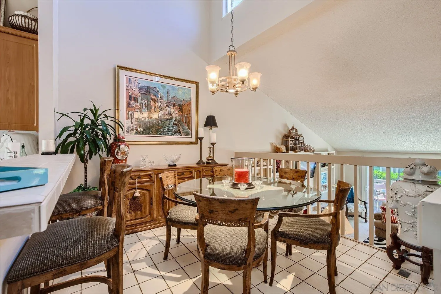 1812 Wilton Road Encinitas, CA 92024 - Photo 14 of 26 a view of a dining room with furniture a rug and wooden floor