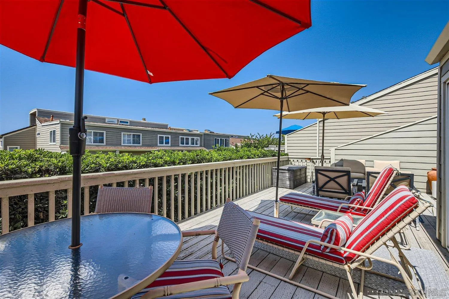 1812 Wilton Road Encinitas, CA 92024 - Photo 18 of 26 a view of a balcony with furniture and umbrella