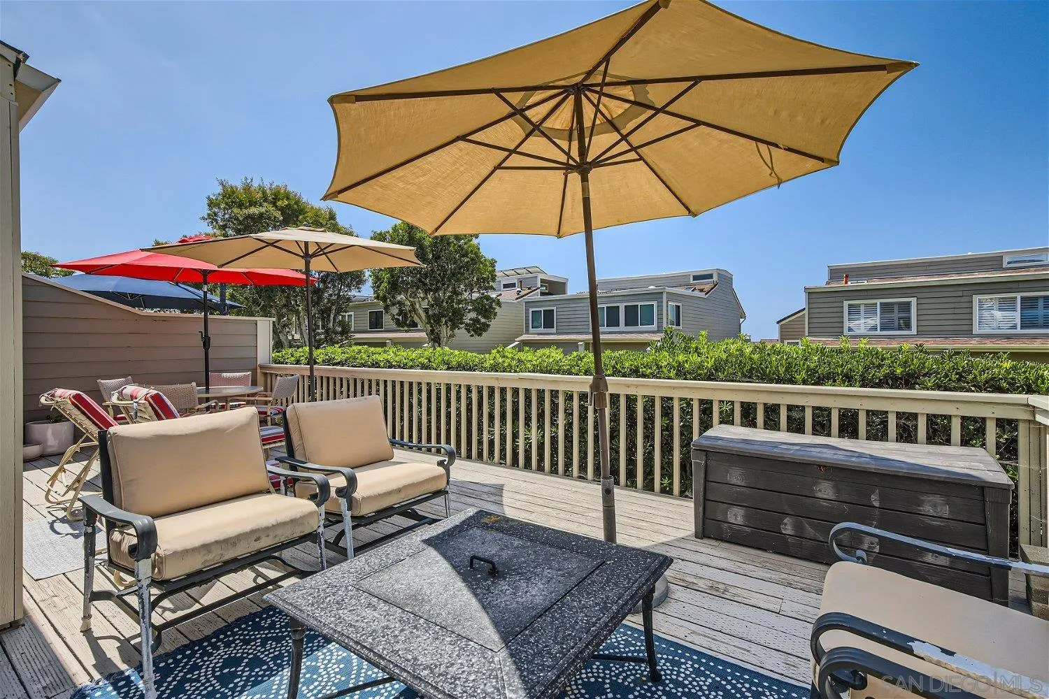 1812 Wilton Road Encinitas, CA 92024 - Photo 19 of 26 a view of a patio with a table and chairs under an umbrella