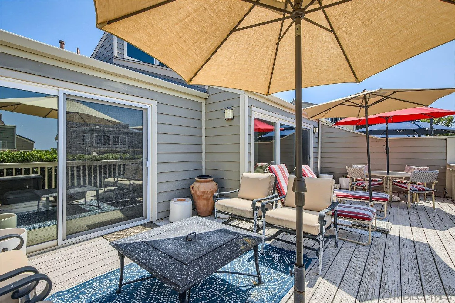 1812 Wilton Road Encinitas, CA 92024 - Photo 20 of 26 a patio with a table and chairs under an umbrella