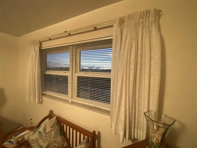 a living room with furniture a dining table and chairs