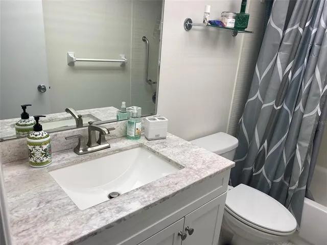 a kitchen with stainless steel appliances granite countertop a refrigerator stove a sink and dishwasher