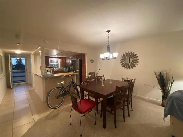 a living room filled with furniture and a large window