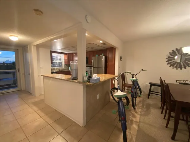 a living room with furniture and floor to ceiling windows