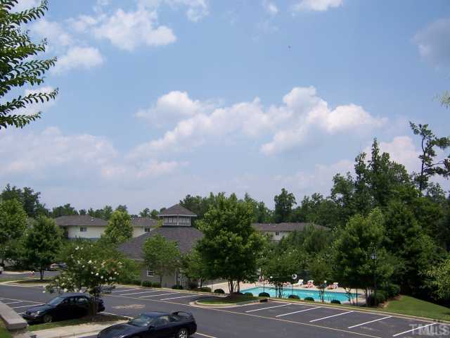 303 Smith Level Road, Unit D23 Chapel Hill, NC 27516 - Photo 3 of 3 a view of a city street and a car parked on the roadside