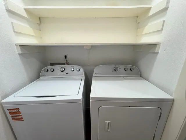 a bathroom with a granite countertop sink toilet and a mirror