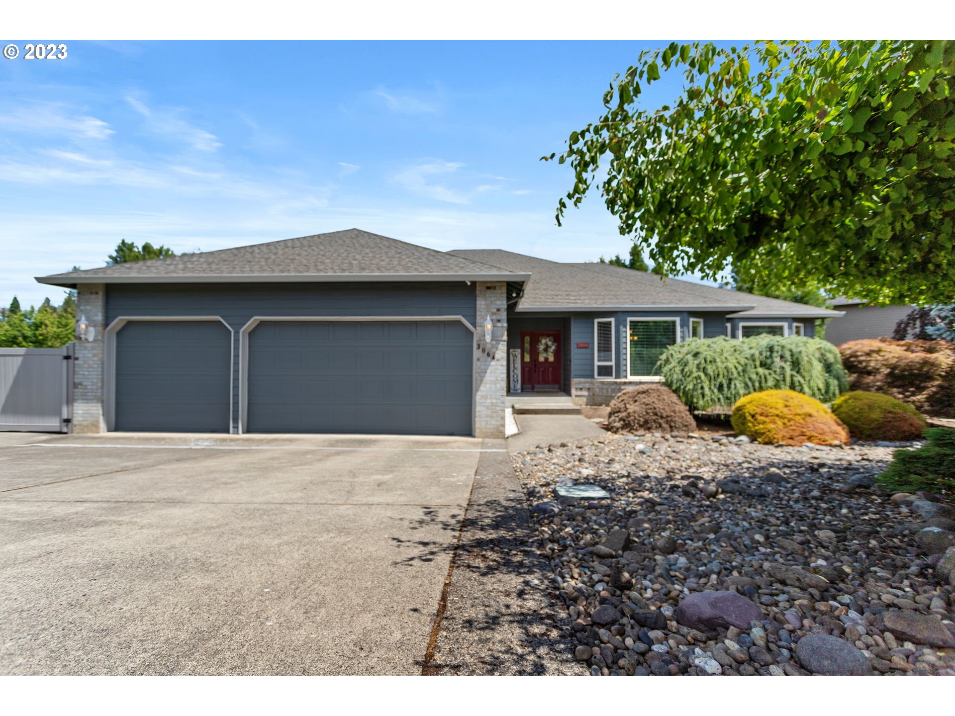 3064 South 23rd Way Ridgefield, WA 98642 - Photo 1 of 29 a front view of a house with a garden