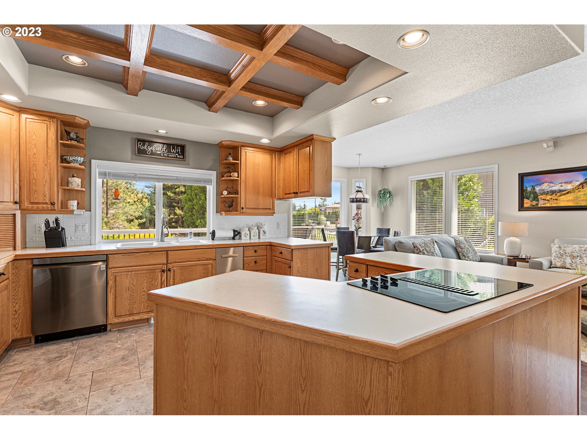 3064 South 23rd Way Ridgefield, WA 98642 - Photo 13 of 29 a kitchen with stainless steel appliances granite countertop a sink window and cabinets