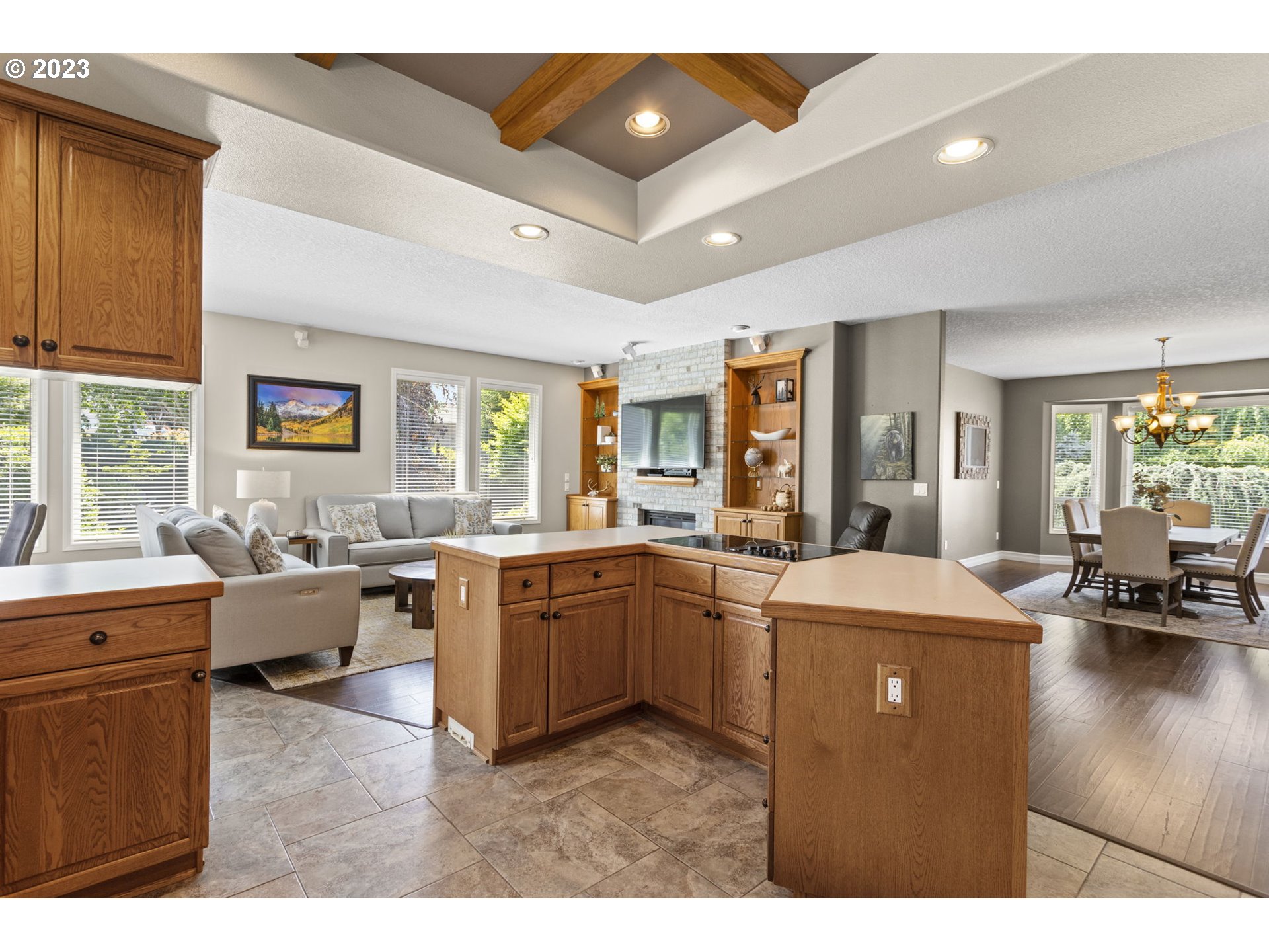 3064 South 23rd Way Ridgefield, WA 98642 - Photo 14 of 29 a kitchen with sink refrigerator and couches