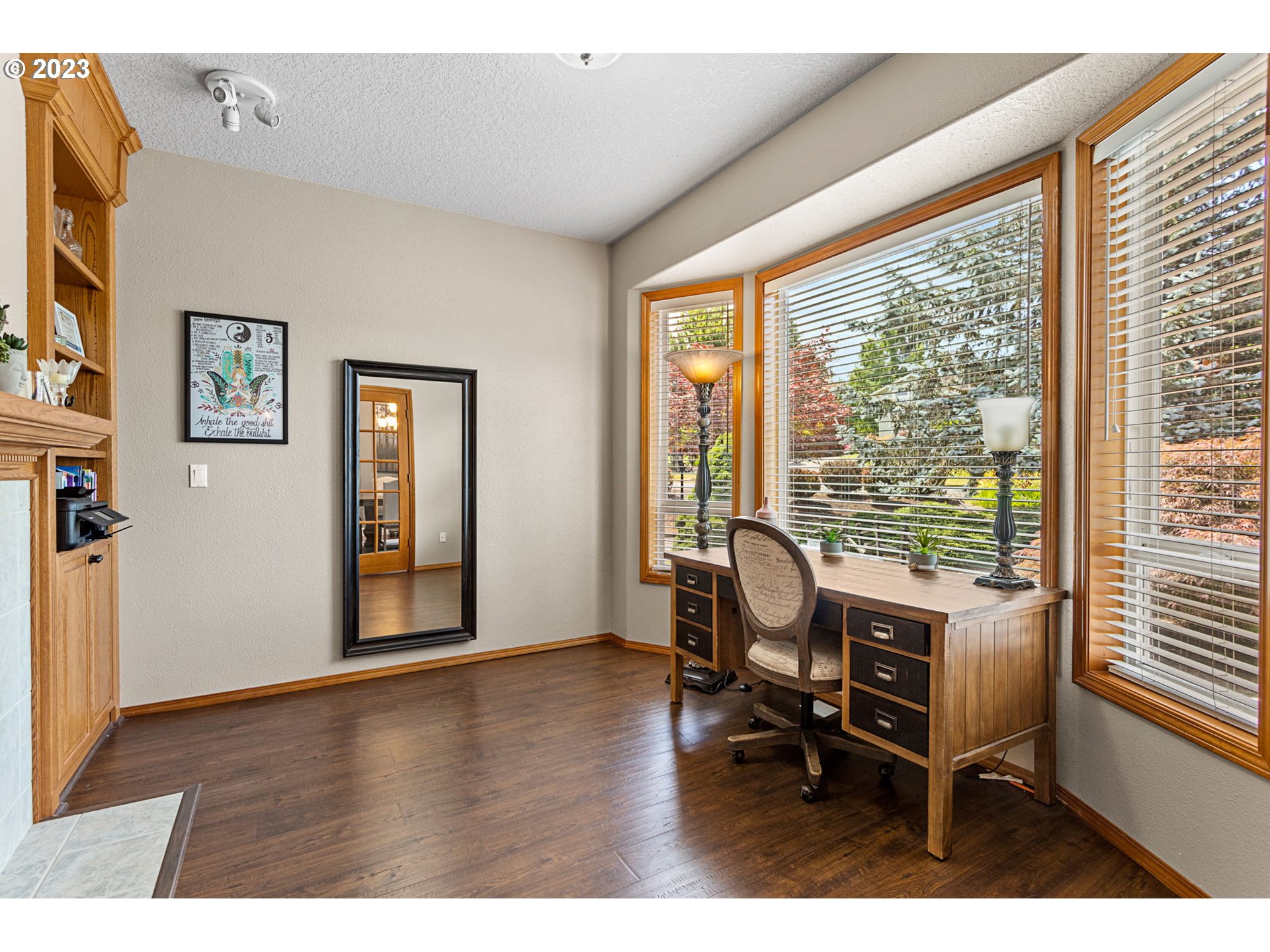 3064 South 23rd Way Ridgefield, WA 98642 - Photo 15 of 29 a workspace with wooden floor and a window
