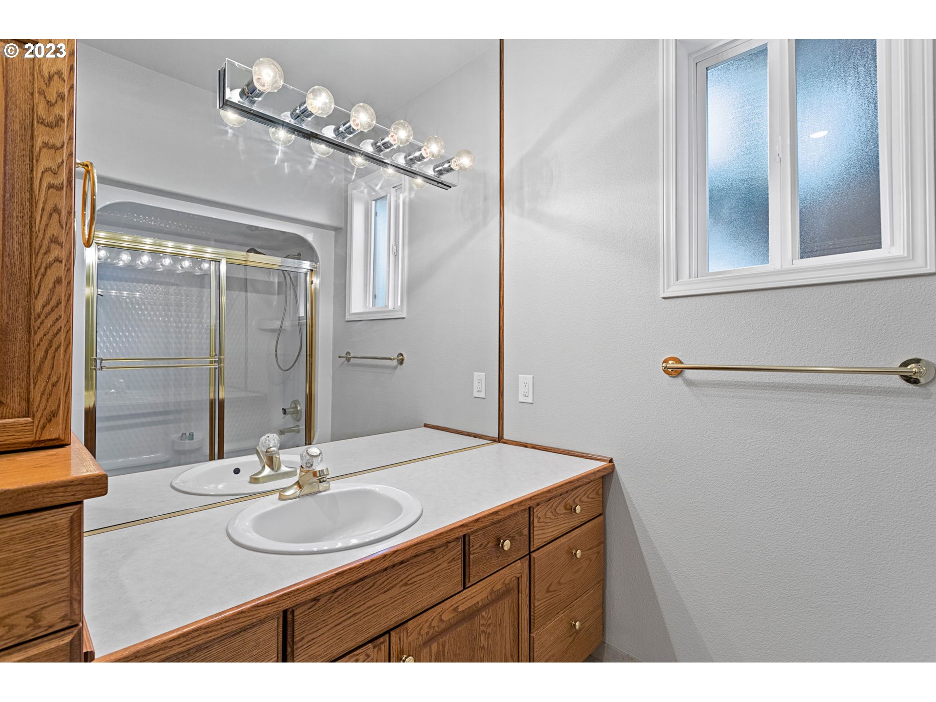 3064 South 23rd Way Ridgefield, WA 98642 - Photo 18 of 29 a bathroom with a sink vanity and a mirror