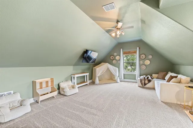 a bedroom with furniture and a chandelier