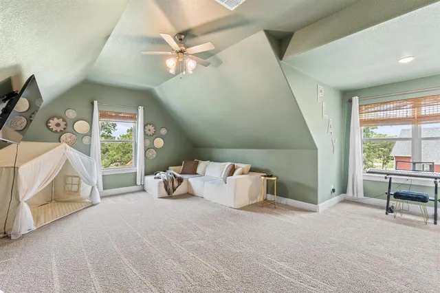 a bedroom with furniture and a window