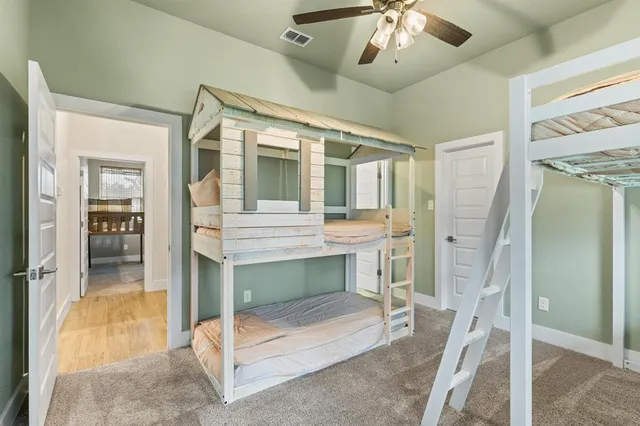 a view of front door with furniture and a chandelier