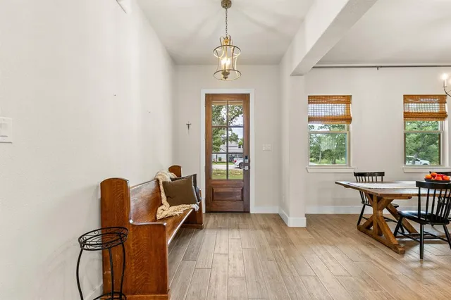 a dining room with furniture and windows