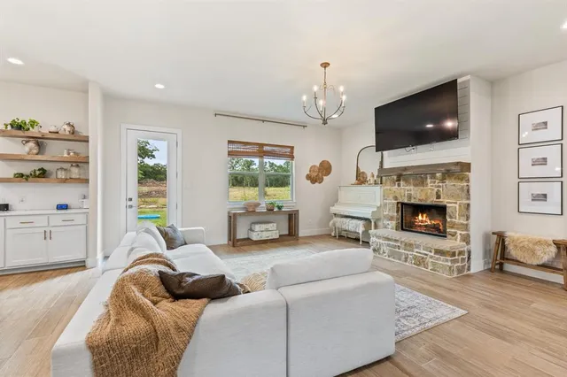 a living room with furniture and a fireplace