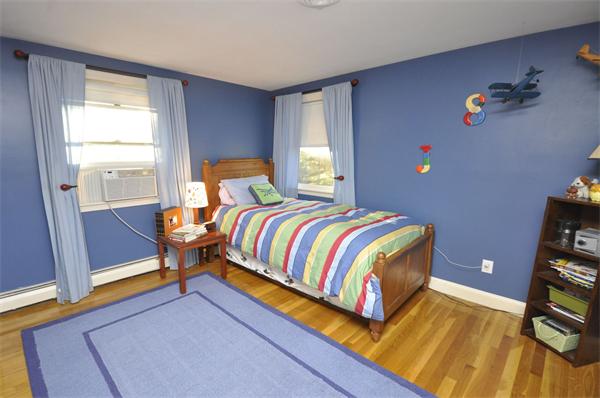 4 Wilmor Road Topsfield, MA 01983 - Photo 24 of 29 a bedroom with a bed and wooden floor