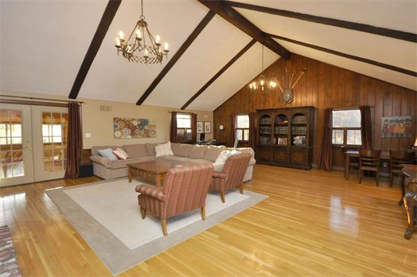 4 Wilmor Road Topsfield, MA 01983 - Photo 4 of 29 a living room with furniture a chandelier and a dining table with wooden floor