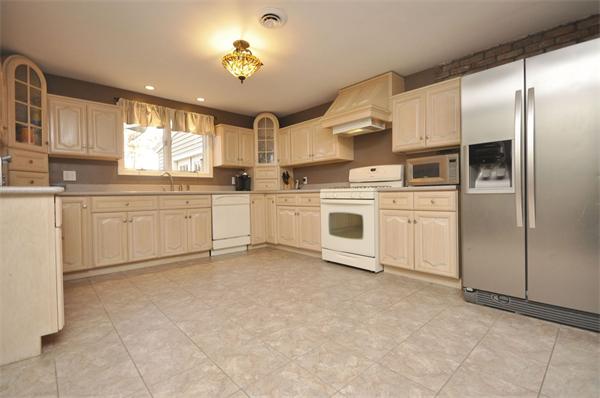 4 Wilmor Road Topsfield, MA 01983 - Photo 9 of 29 a kitchen with white cabinets and white appliances