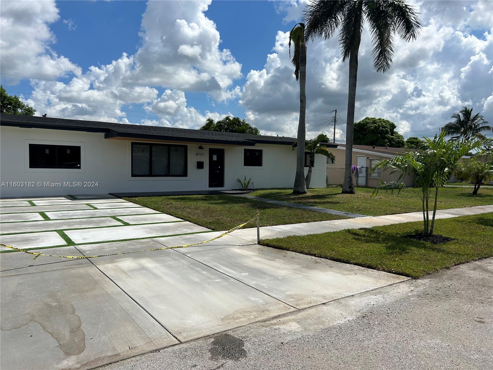 Westchester Miami, FL 33165 - Photo 9 of 14 a house with yard in front of it