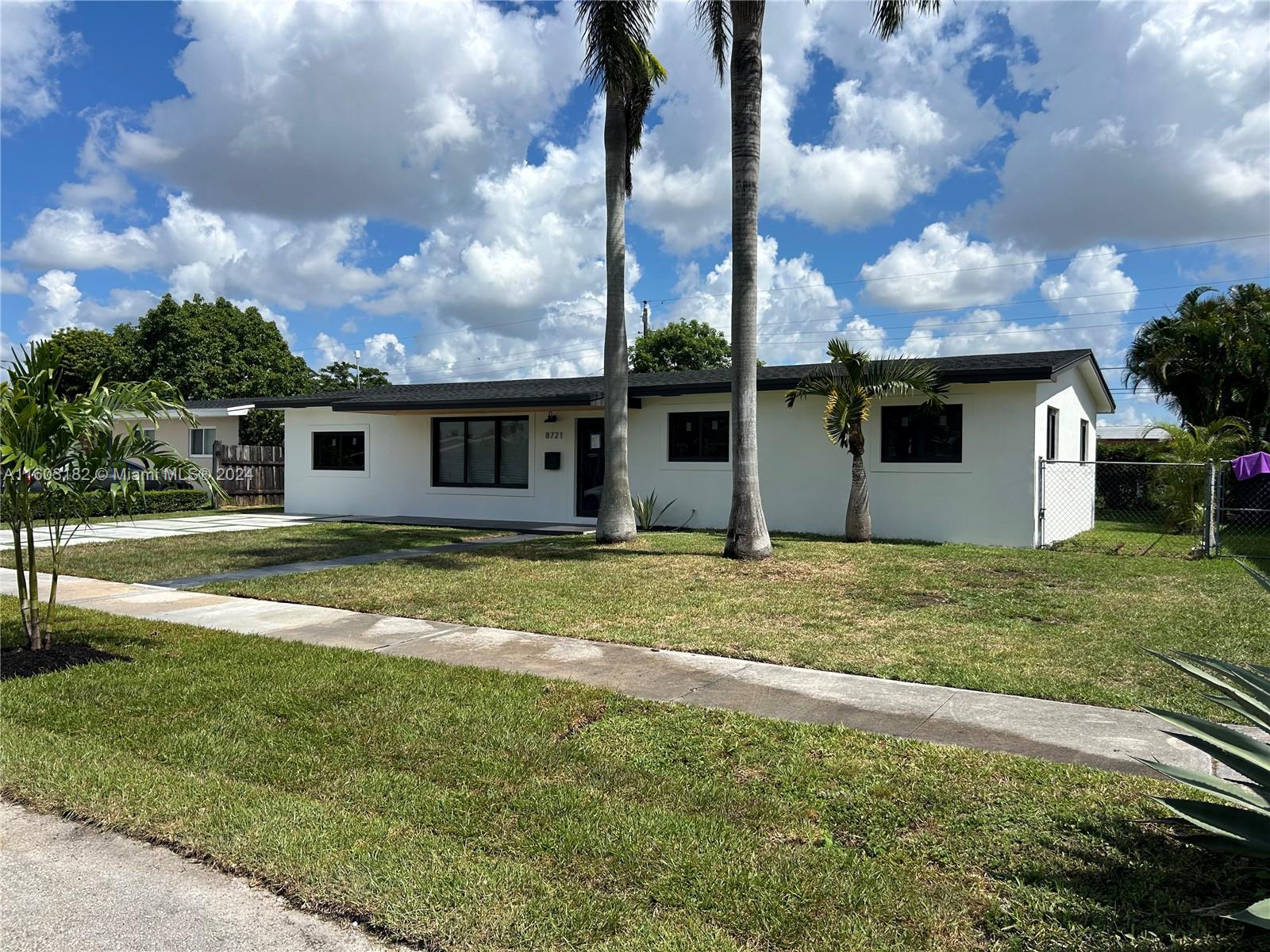 Westchester Miami, FL 33165 - Photo 10 of 14 a view of an house with backyard space and garden