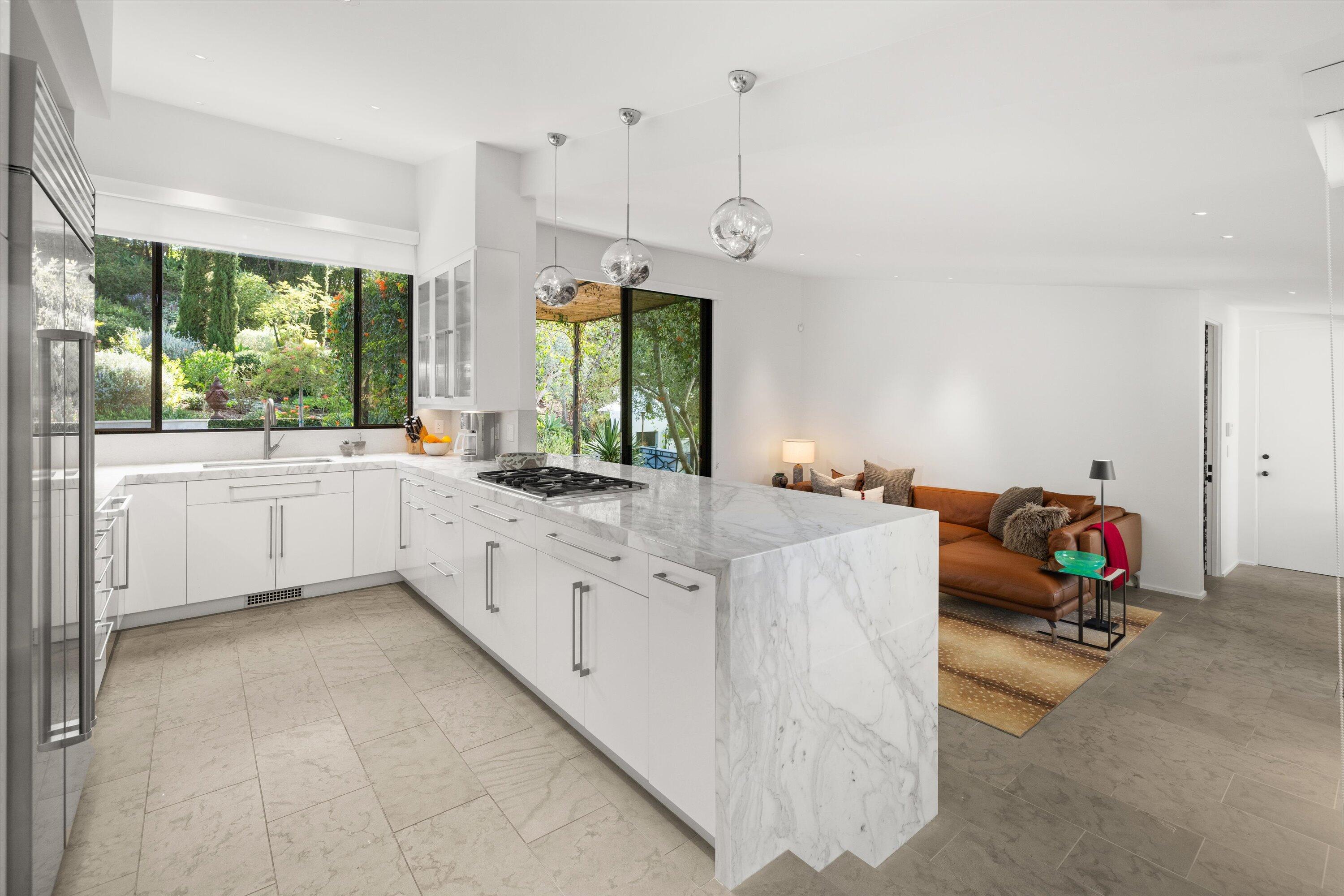 448 Court Place Montecito, CA 93108 - Photo 12 of 33 a large white room with a large window and chandelier