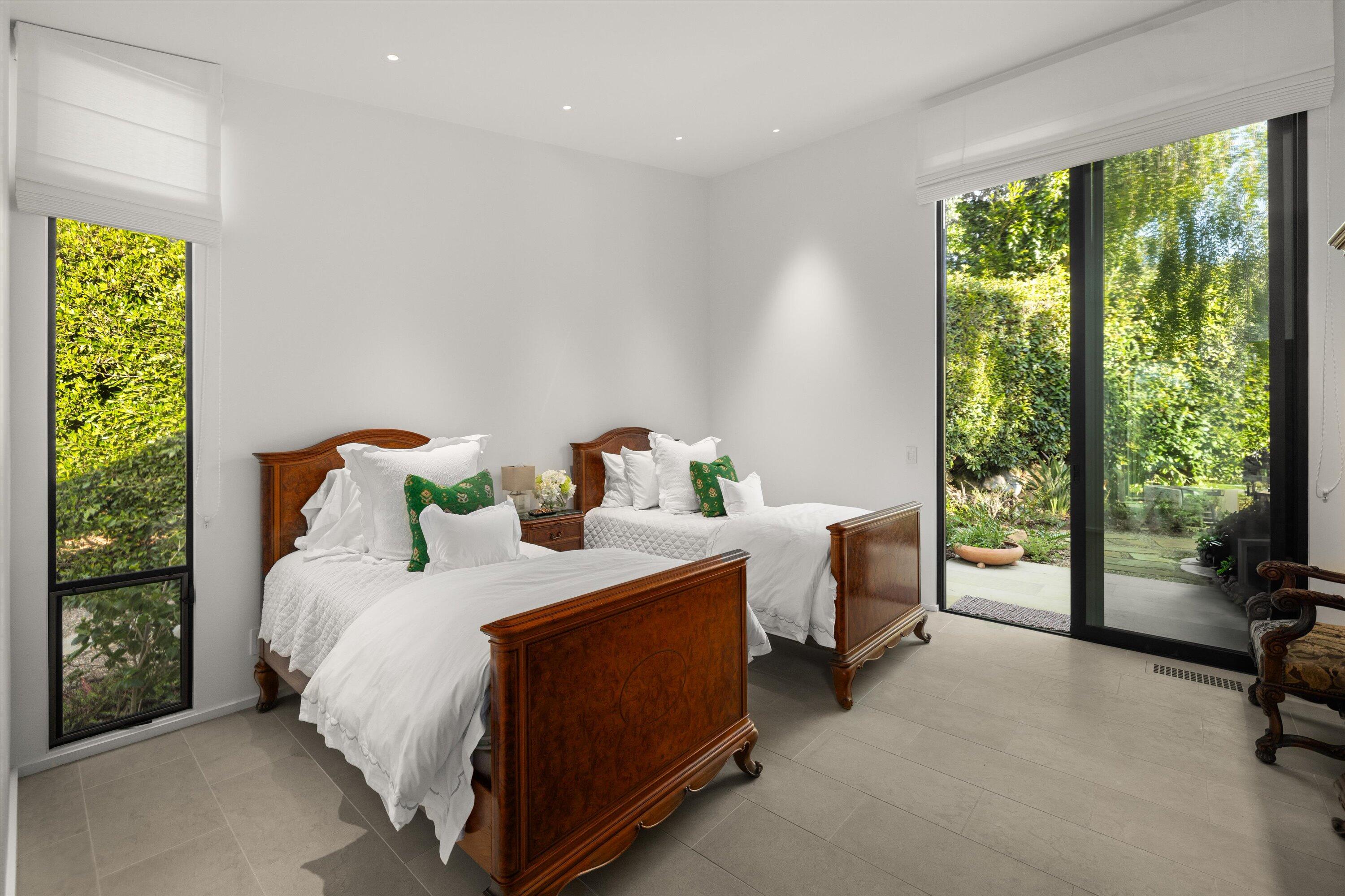 448 Court Place Montecito, CA 93108 - Photo 18 of 33 a bedroom with a bed and a table chair