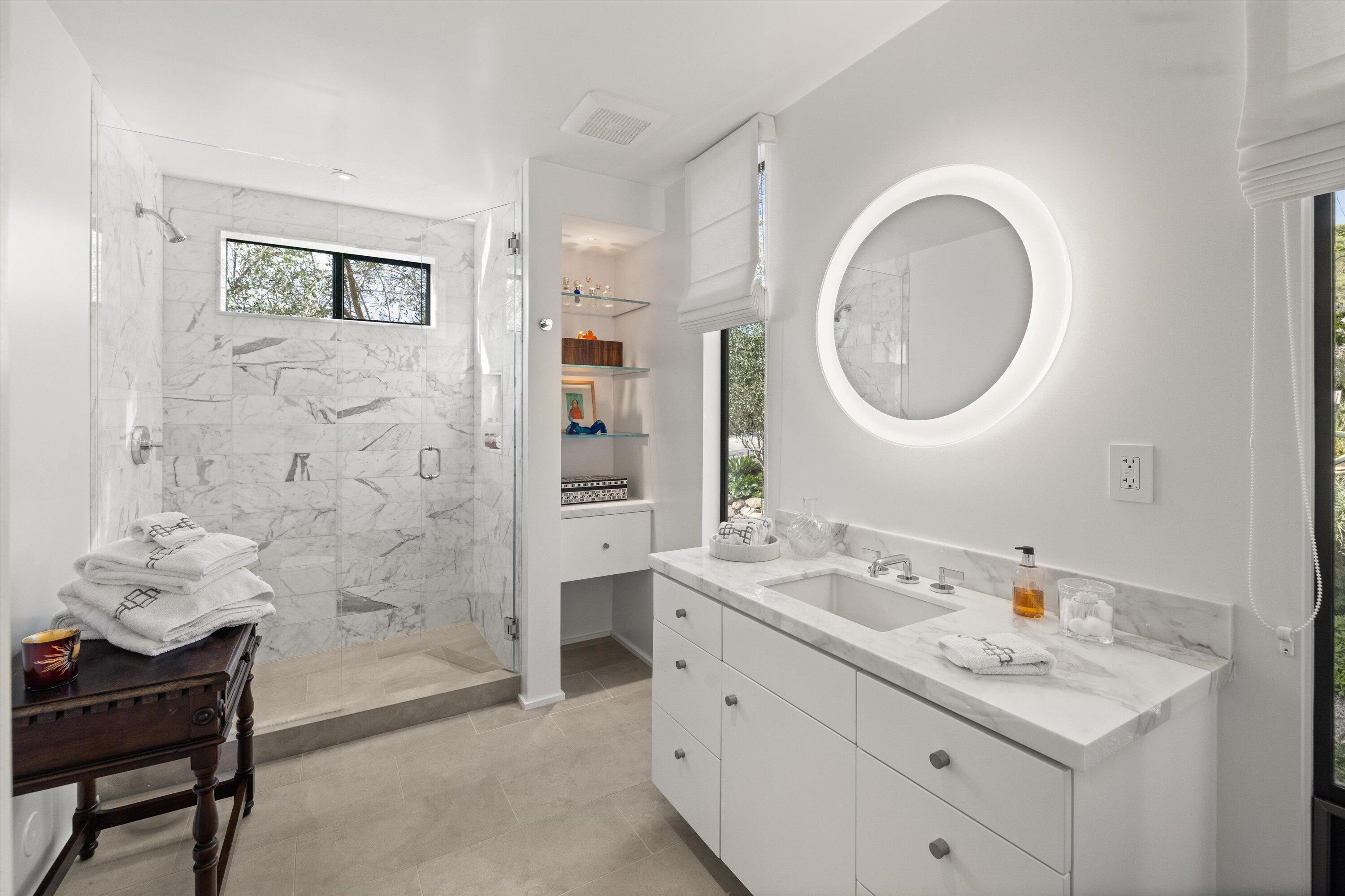 448 Court Place Montecito, CA 93108 - Photo 19 of 33 a bathroom with a bathtub sink vanity mirror and shower