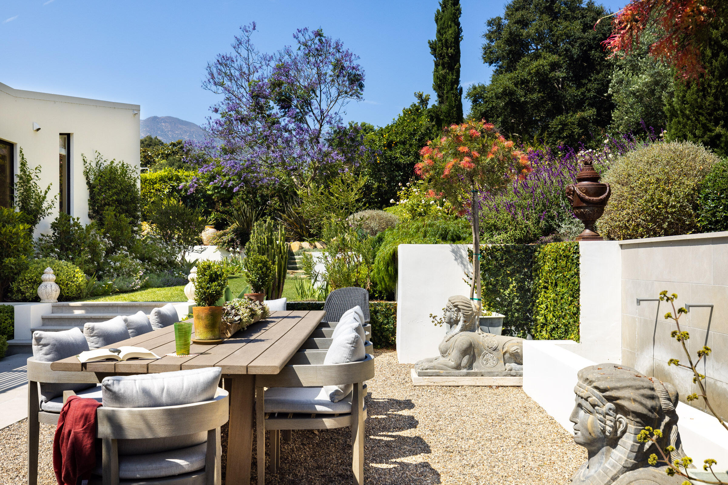448 Court Place Montecito, CA 93108 - Photo 21 of 33 a view of a patio with table and chairs and potted plants