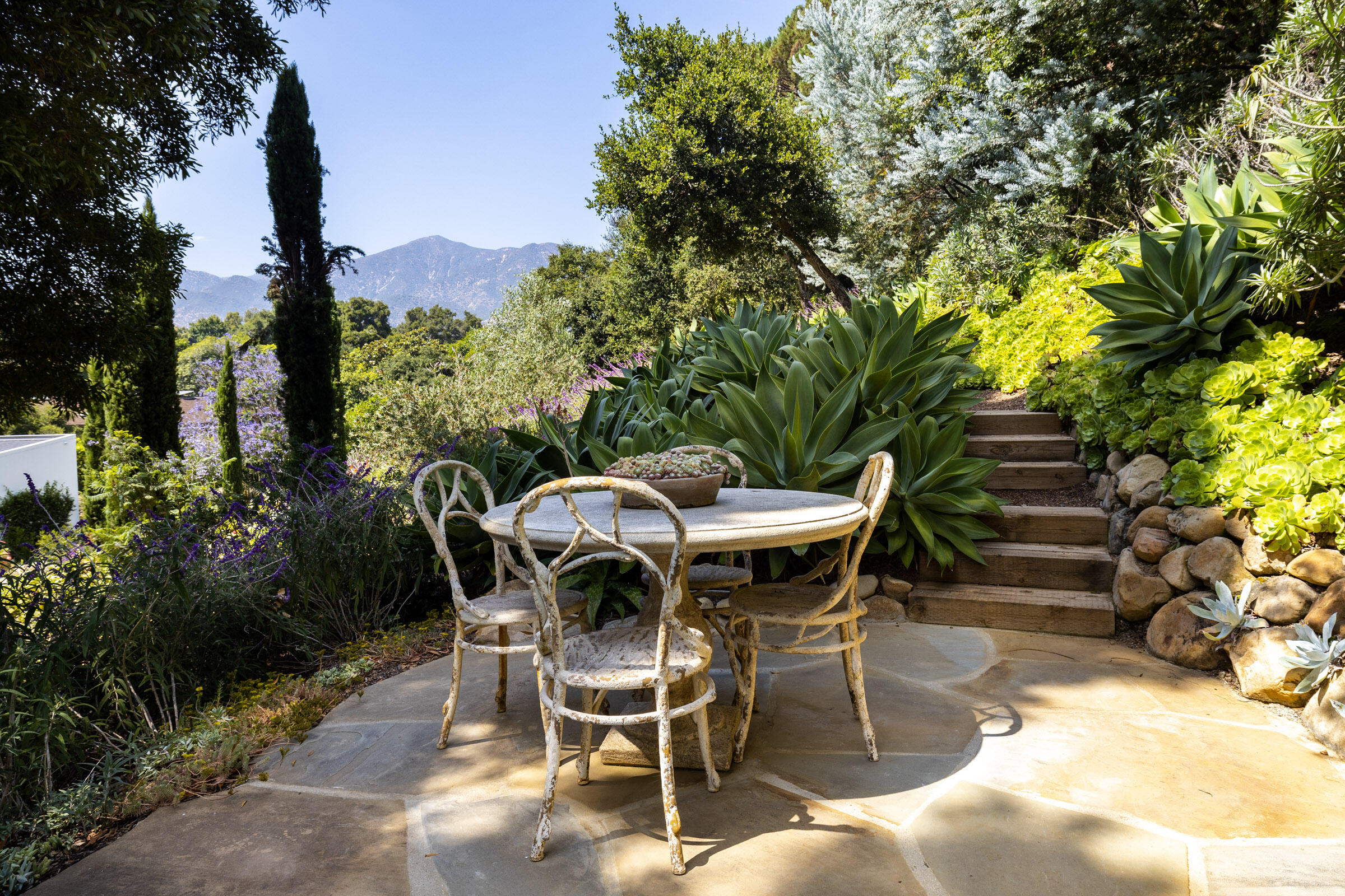 448 Court Place Montecito, CA 93108 - Photo 25 of 33 a view of a dining table and chairs in the patio