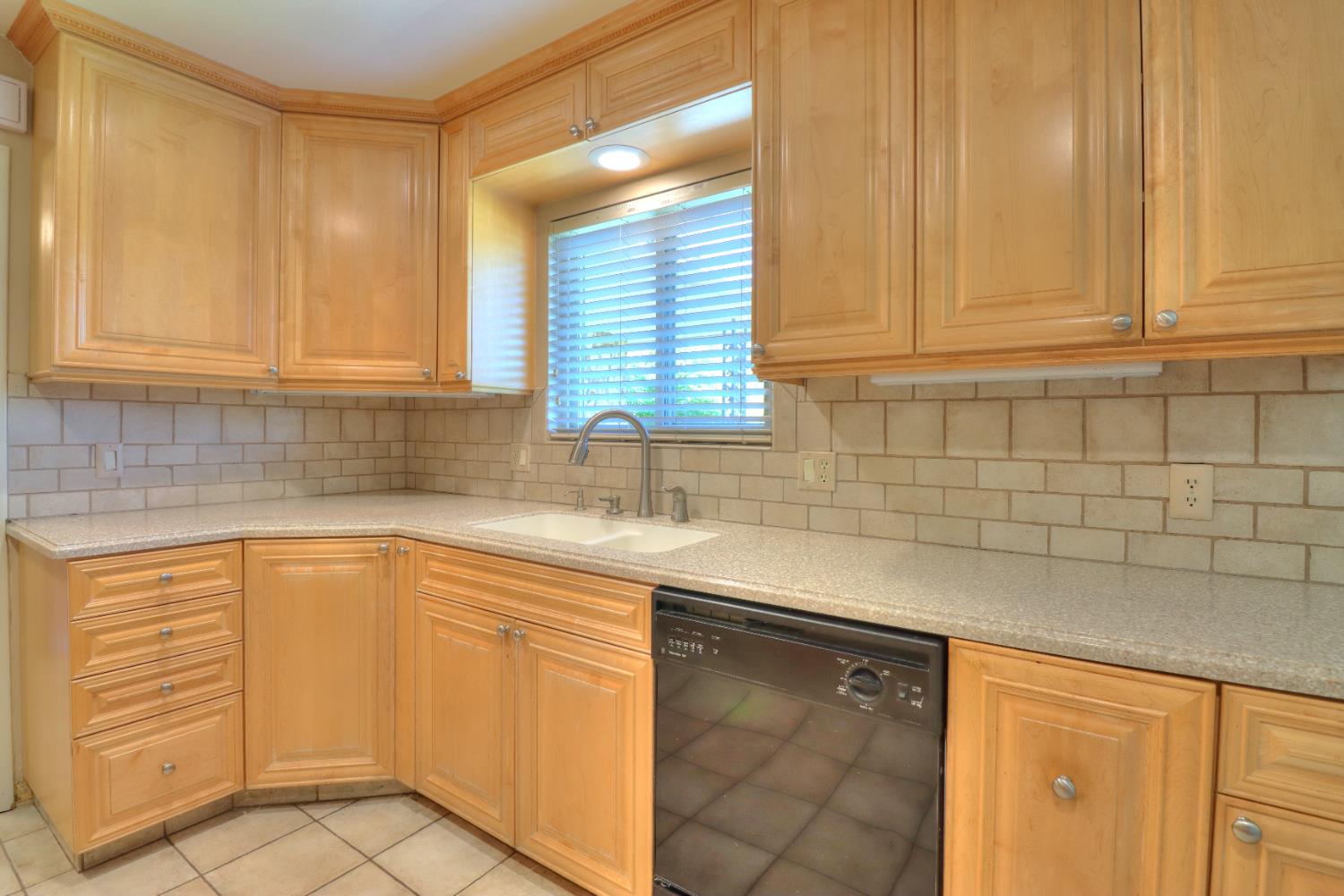 6265 North Colonial Avenue Fresno, CA 93704 - Photo 7 of 22 a kitchen with cabinets and window