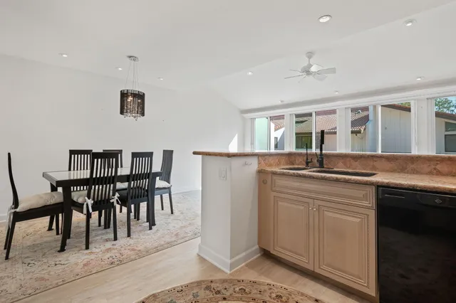 a kitchen with granite countertop a sink and a window