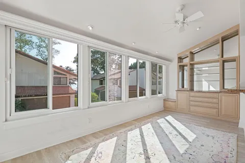 a view of a big room with windows