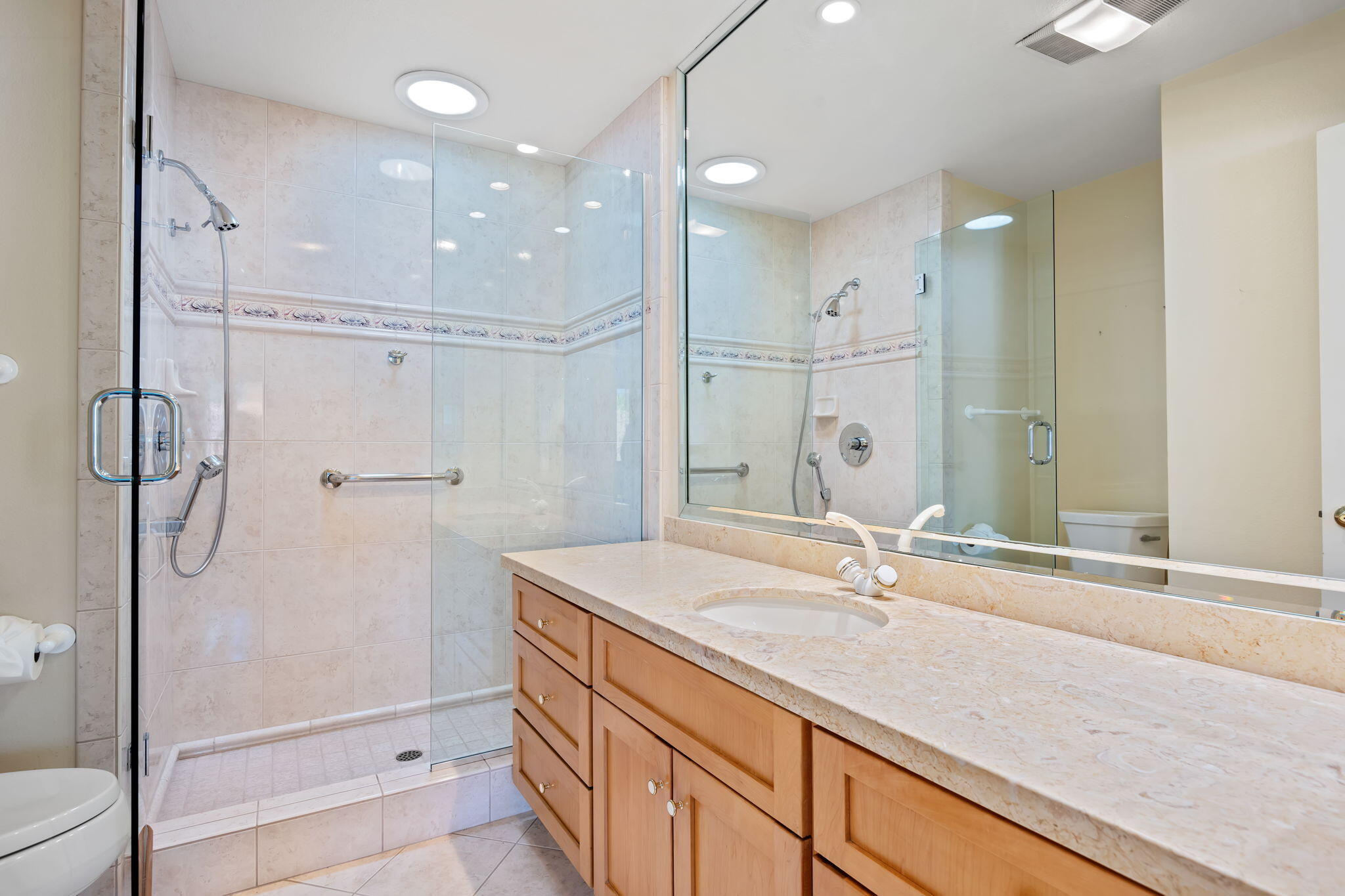 659 Del Parque Drive, Unit E Santa Barbara, CA 93103 - Photo 18 of 32 a bathroom with a shower sink and mirror