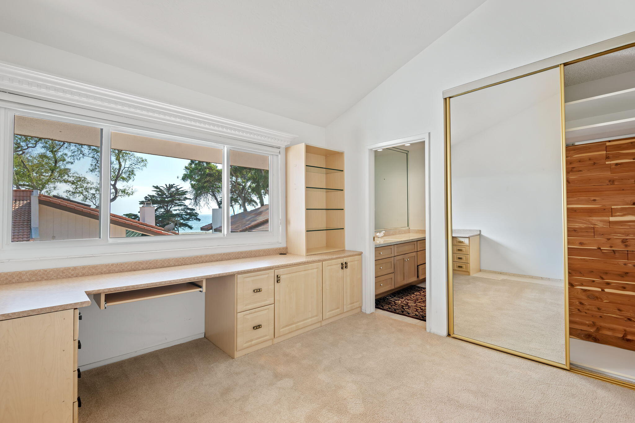659 Del Parque Drive, Unit E Santa Barbara, CA 93103 - Photo 20 of 32 an empty room with window and cabinet