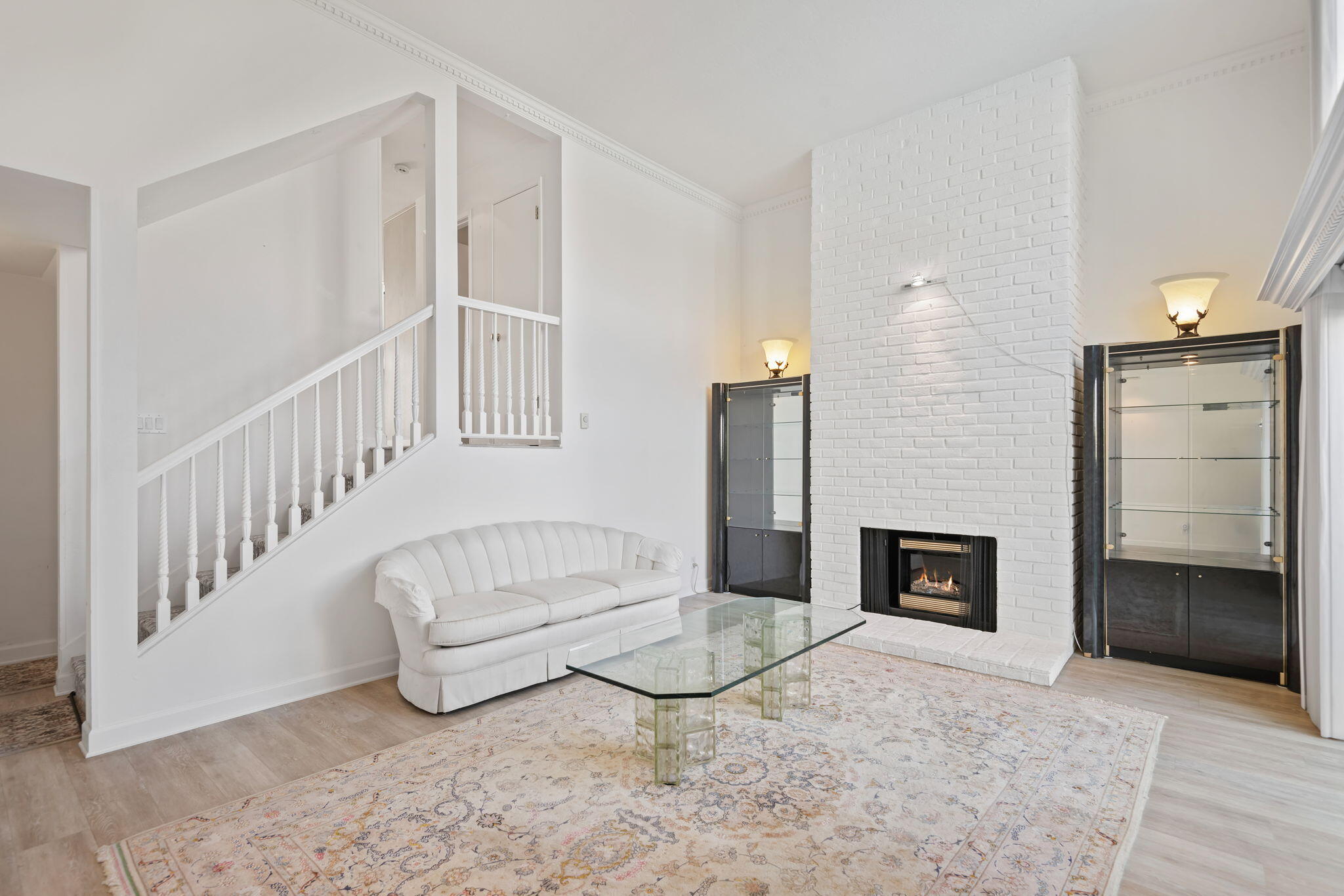 659 Del Parque Drive, Unit E Santa Barbara, CA 93103 - Photo 4 of 32 a living room with furniture and a fireplace