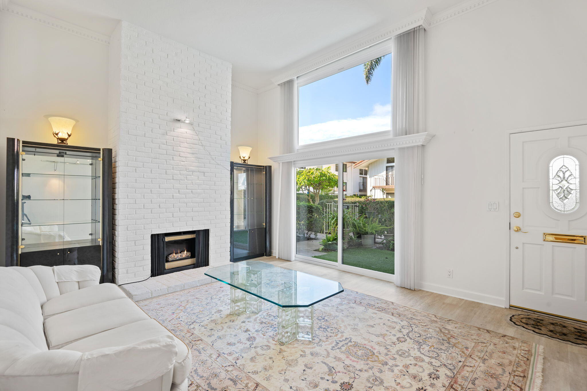 659 Del Parque Drive, Unit E Santa Barbara, CA 93103 - Photo 5 of 32 a living room with furniture and a fireplace