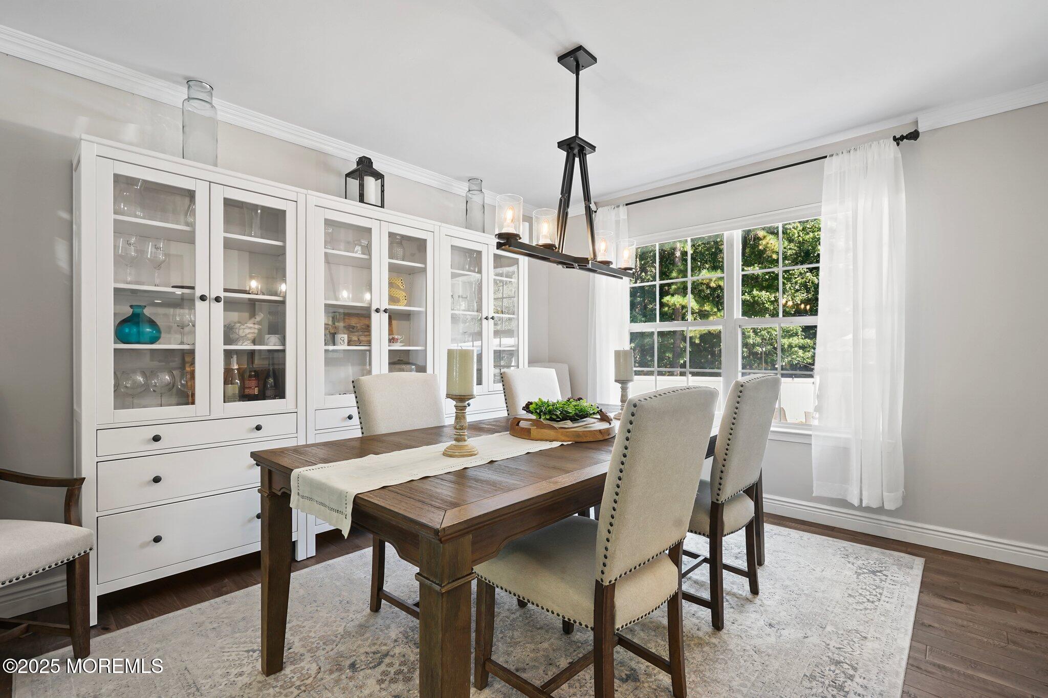 24 Mount Ranier Drive Howell, NJ 07731 - Photo 11 of 53 a view of a dining room with furniture window and outside view