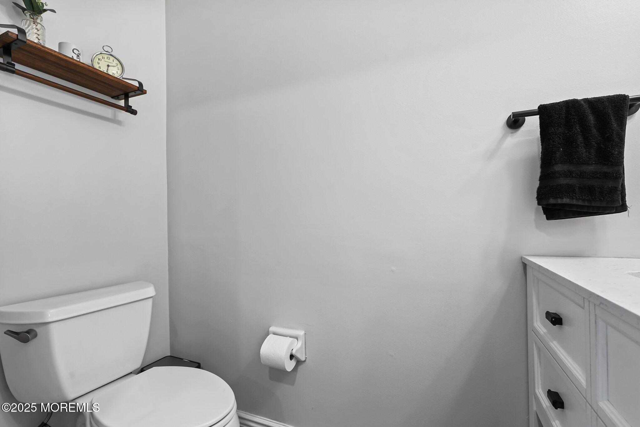 24 Mount Ranier Drive Howell, NJ 07731 - Photo 20 of 53 a white toilet sitting next to a bathroom sink