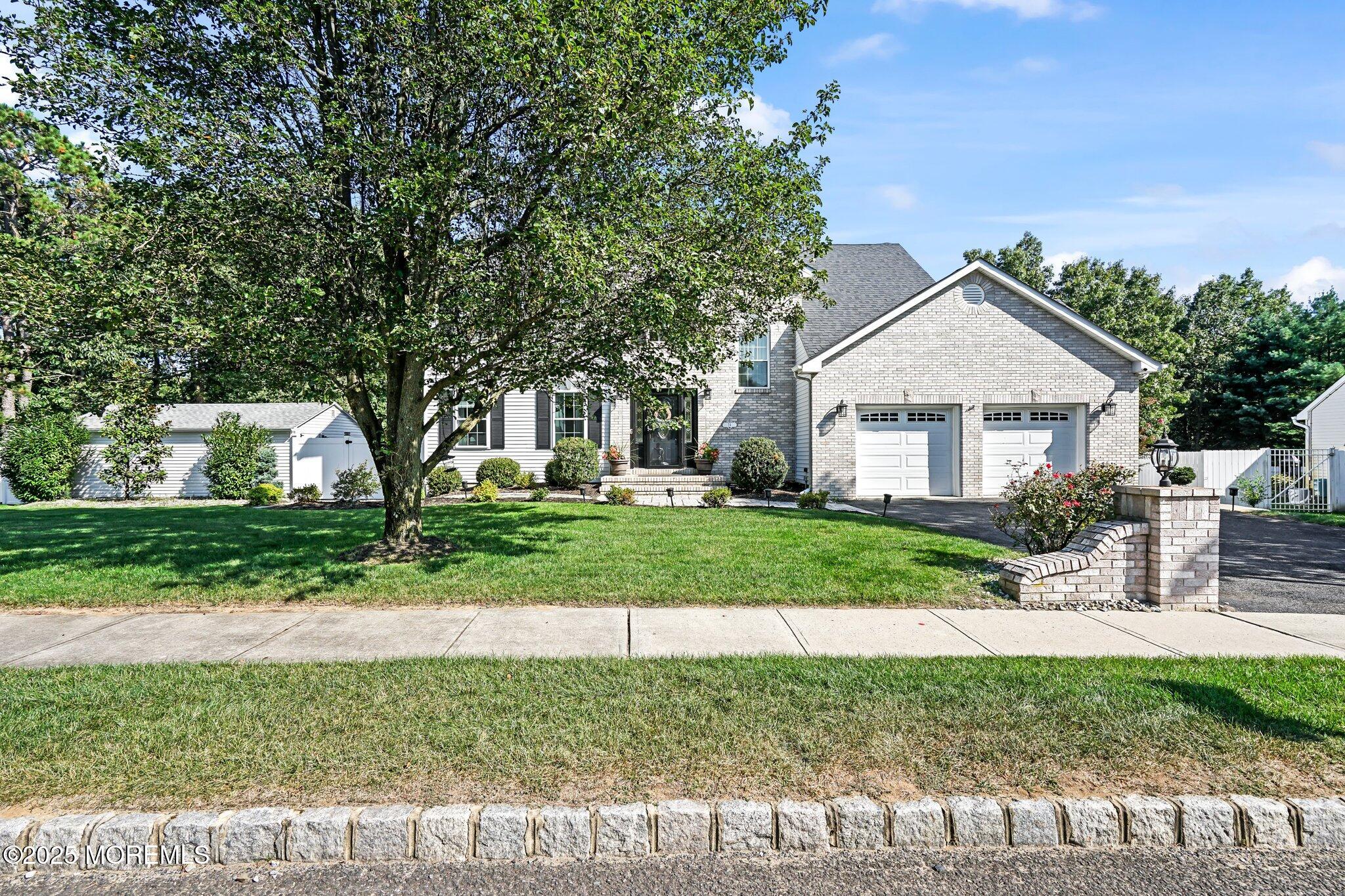 24 Mount Ranier Drive Howell, NJ 07731 - Photo 2 of 53 a front view of a house with a yard