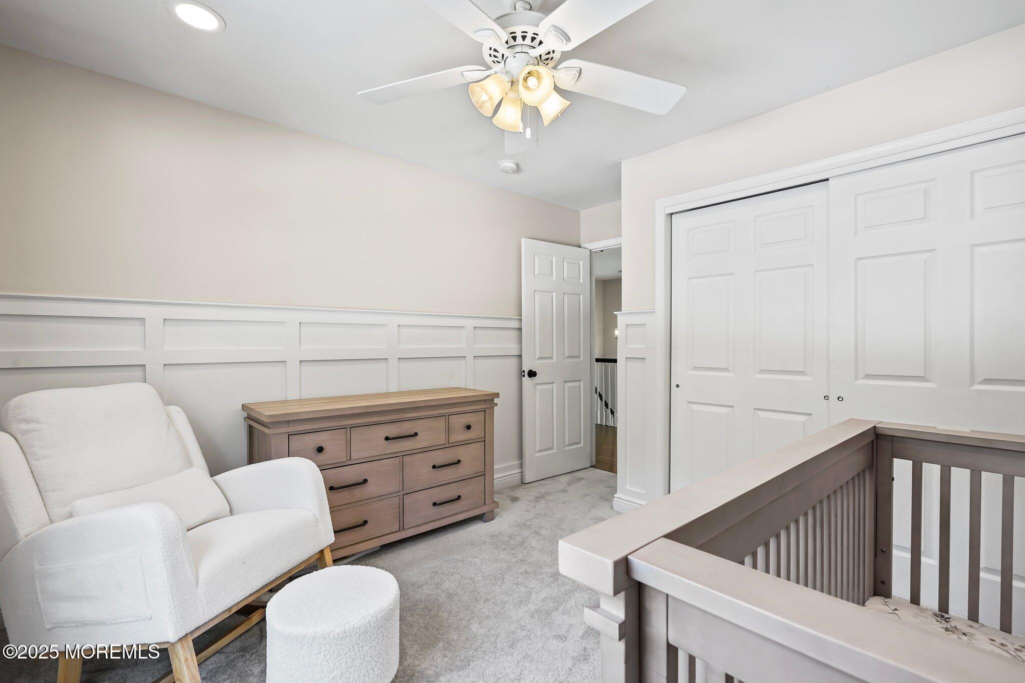 24 Mount Ranier Drive Howell, NJ 07731 - Photo 25 of 53 a living room with furniture and a chandelier